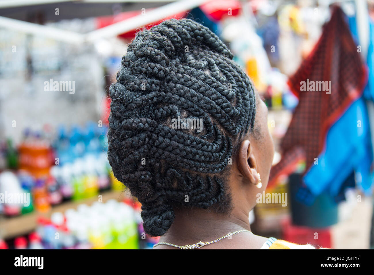 Woman with elaborately braided hair in Maputo, Mozambique Stock Photo