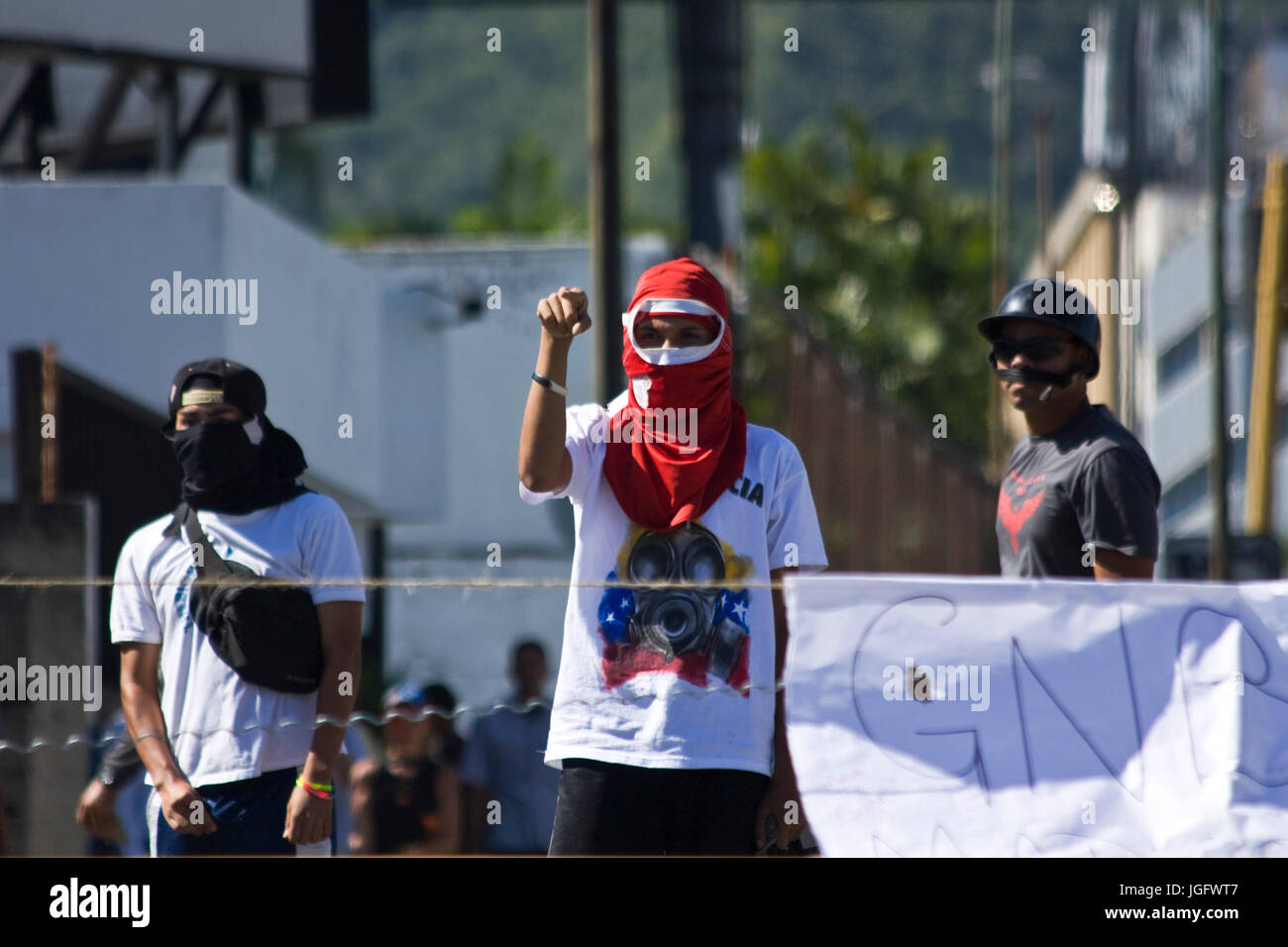 Demonstrators confront the Bolivarian National Guard during a protests named 'El Trancazo' against the government of Nicolás Maduro in Caracas. Stock Photo