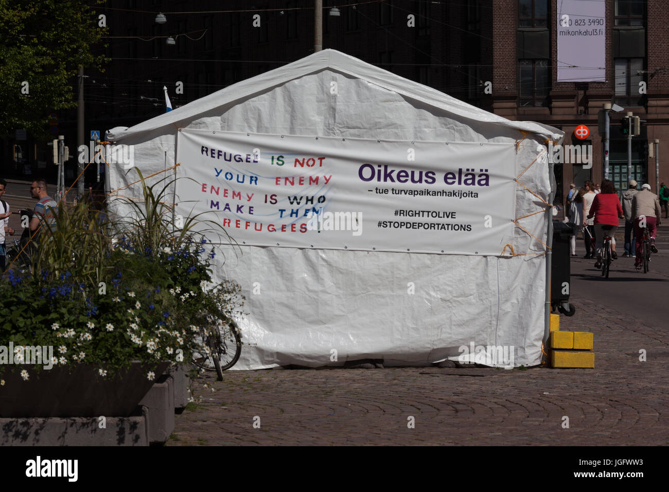 Refugees Square Refugees at Main square at station in Helsinki. Refugees are not your ...