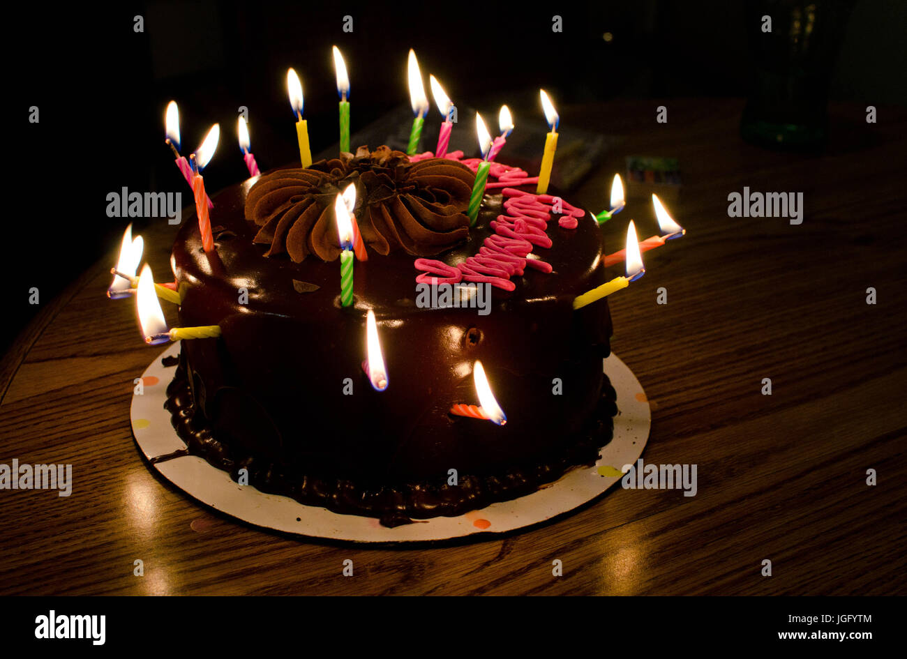 Birthday cake with 21 candles sticking out of all sides Stock Photo