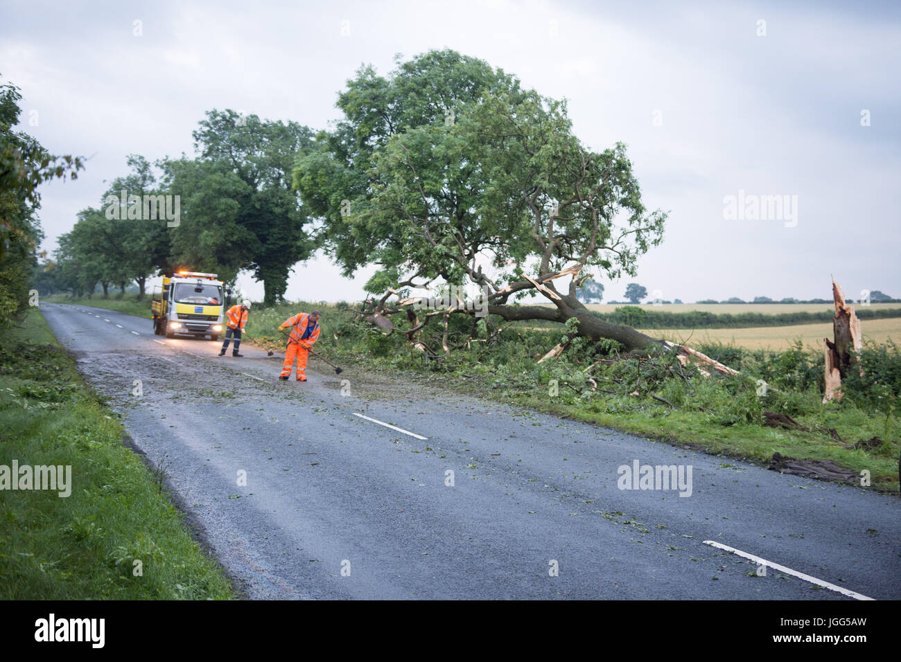 North Grimston, Malton, UK. 6th July, 2017. The b1248 was closed after a storm struck a tree and it felled across the road. Credit: Richard Smith/Alamy Live News Stock Photo