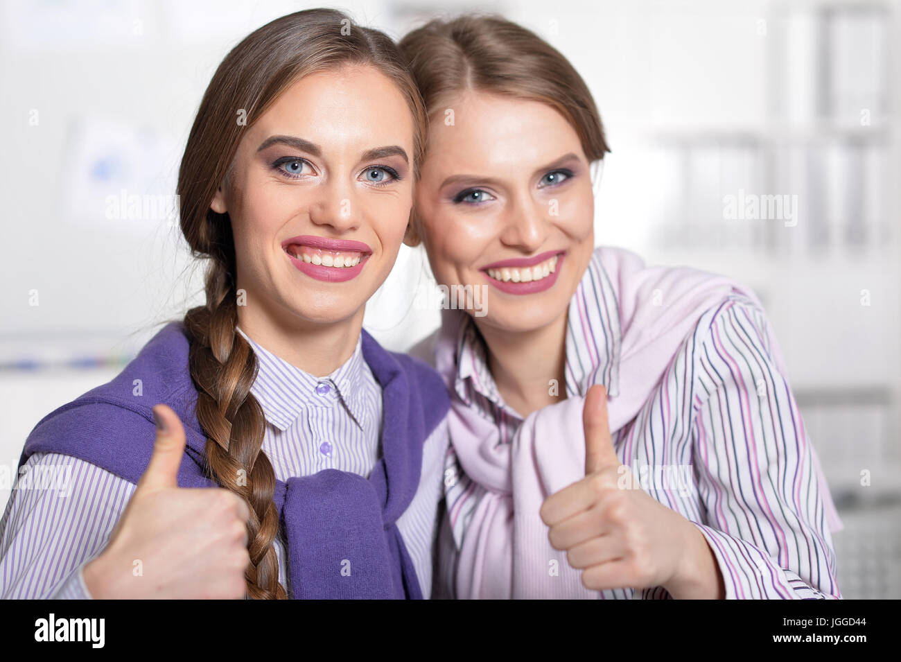 Two smiling beautiful girls Stock Photo - Alamy