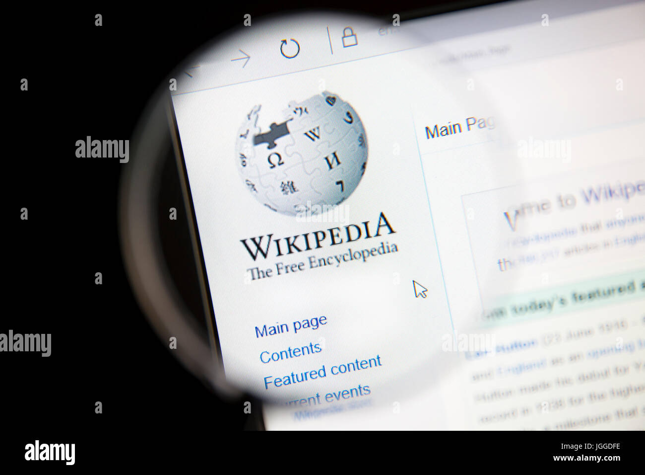 Wikipedia website under a magnifying glass Wikipedia is a free Internet encyclopedia. Stock Photo