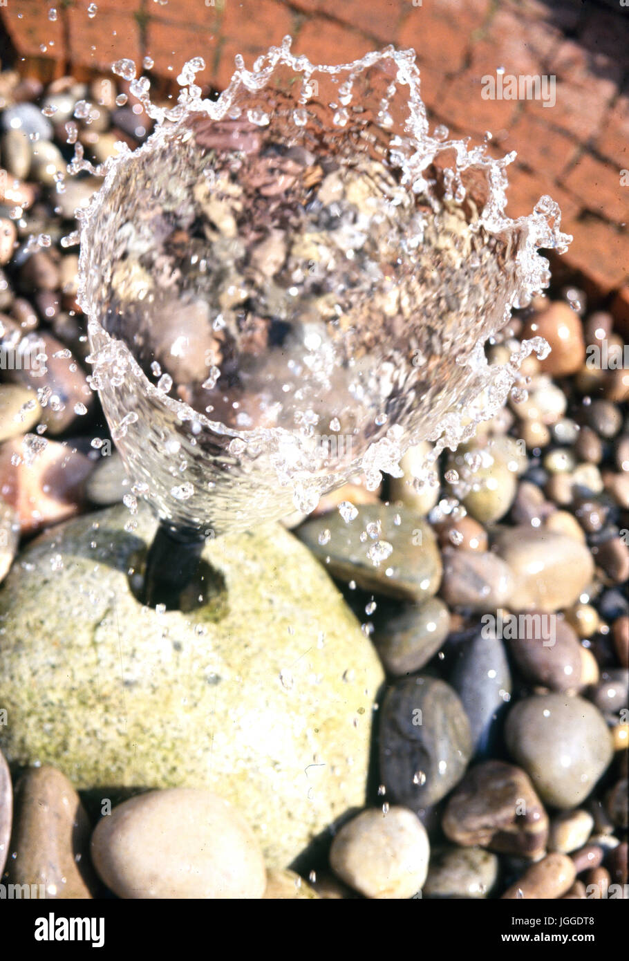 Bubble fountain surrounded by stones Stock Photo Alamy