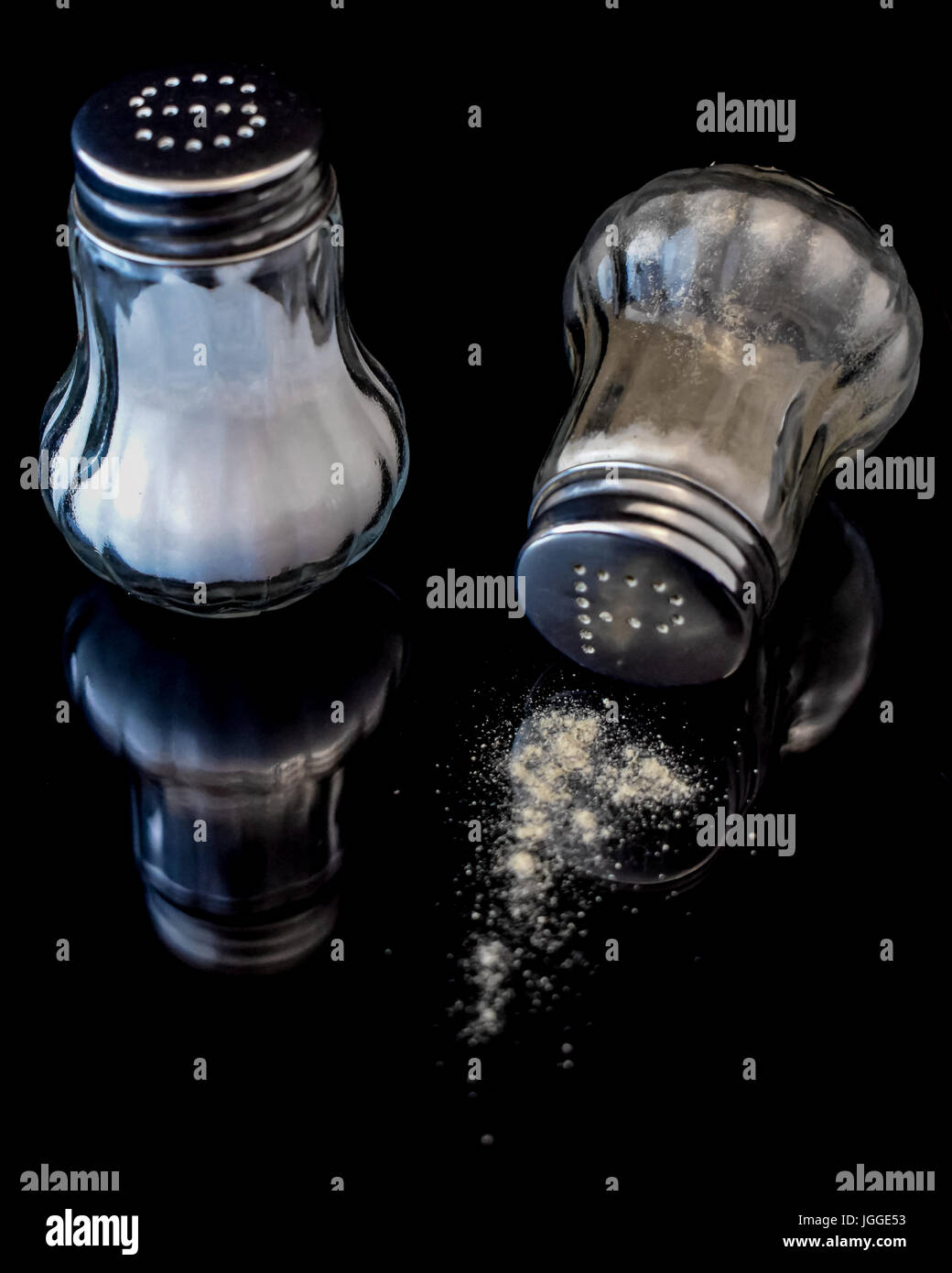 Pepper shaker of ground paprika pepper on a wooden background Stock Photo -  Alamy