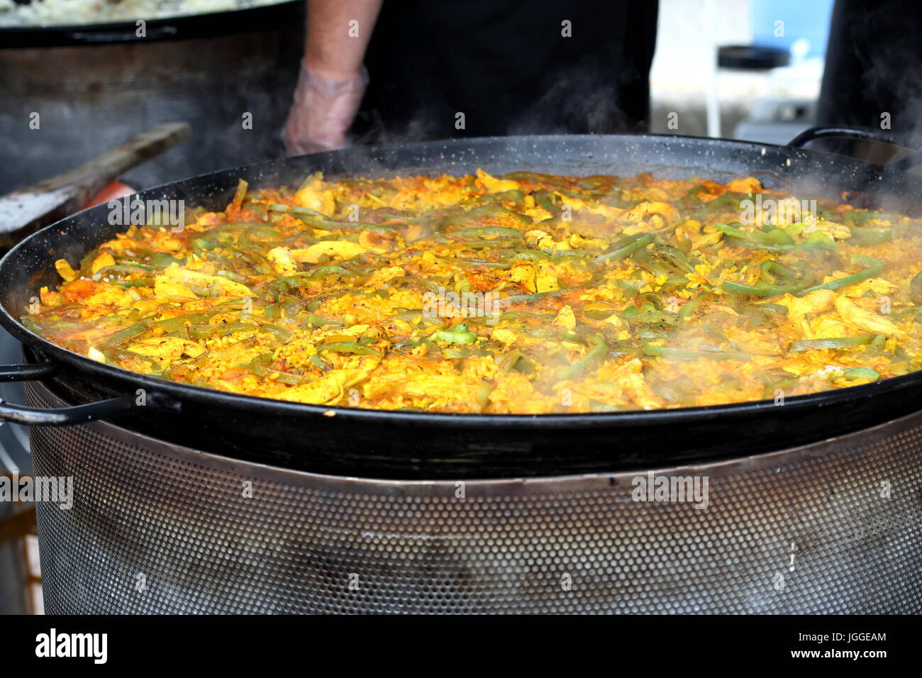 Spanish Paella cooking in a big paella pan Stock Photo Alamy