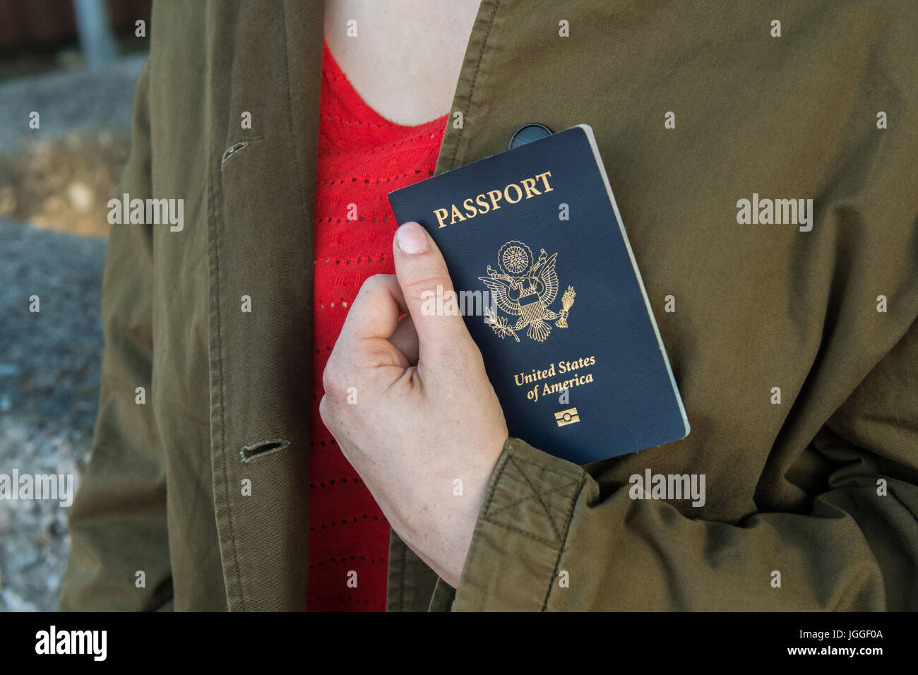 Image of a woman’s hand holding a passport Stock Photo Alamy