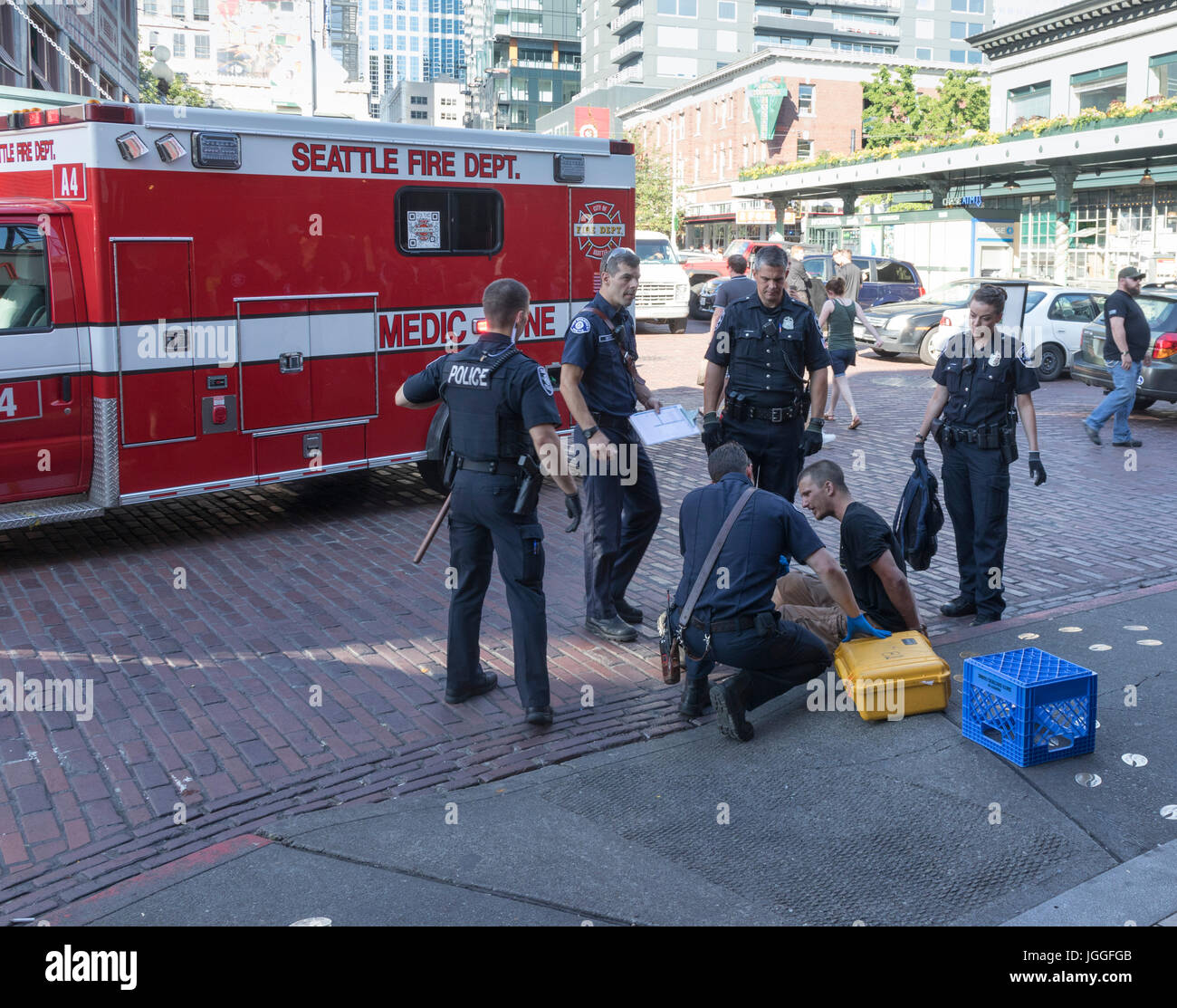 police surround arrested and handcuffed man, Seattle, USA Stock Photo