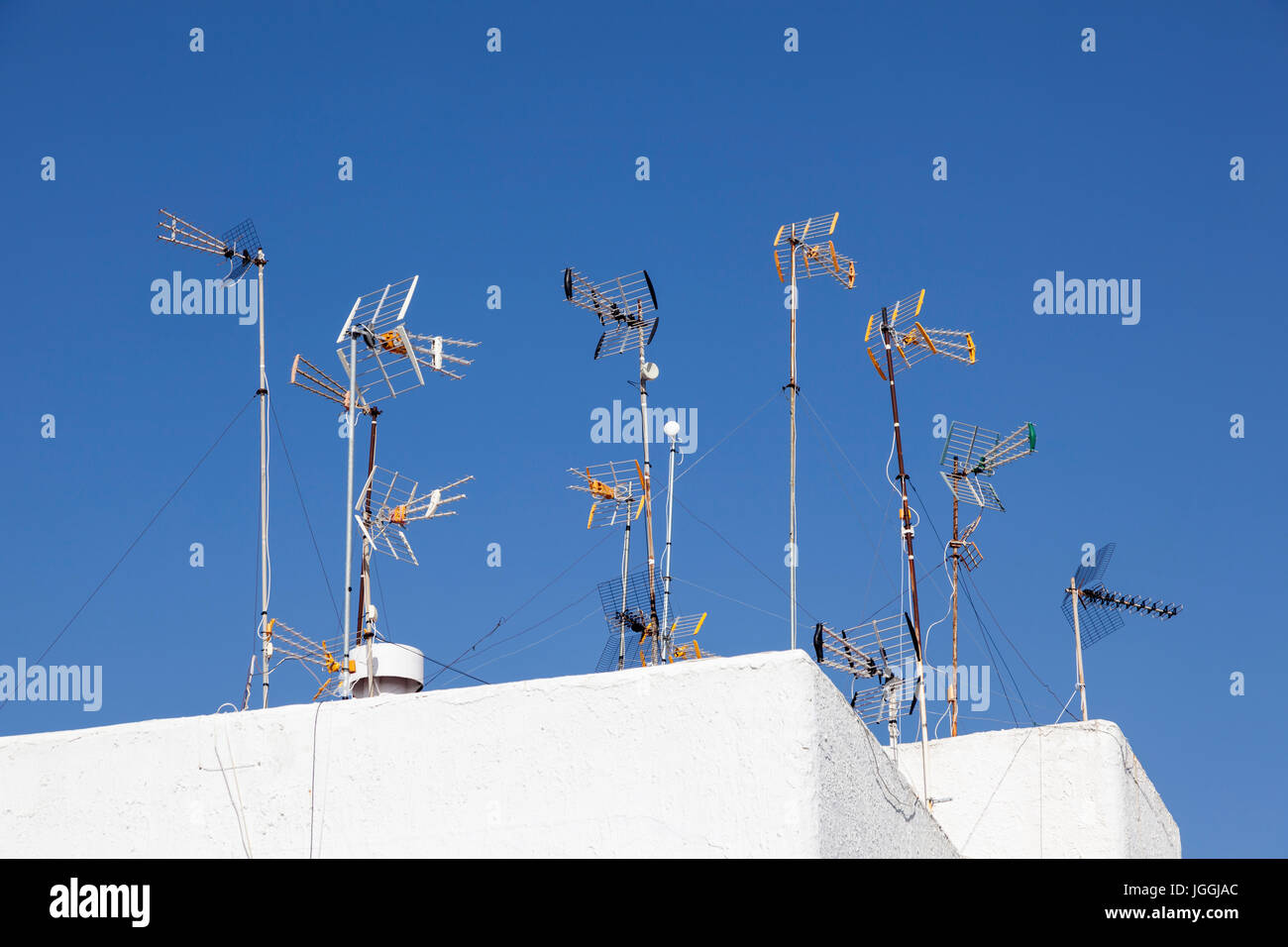 TV antennas on top of the roof of a residential house Stock Photo Alamy