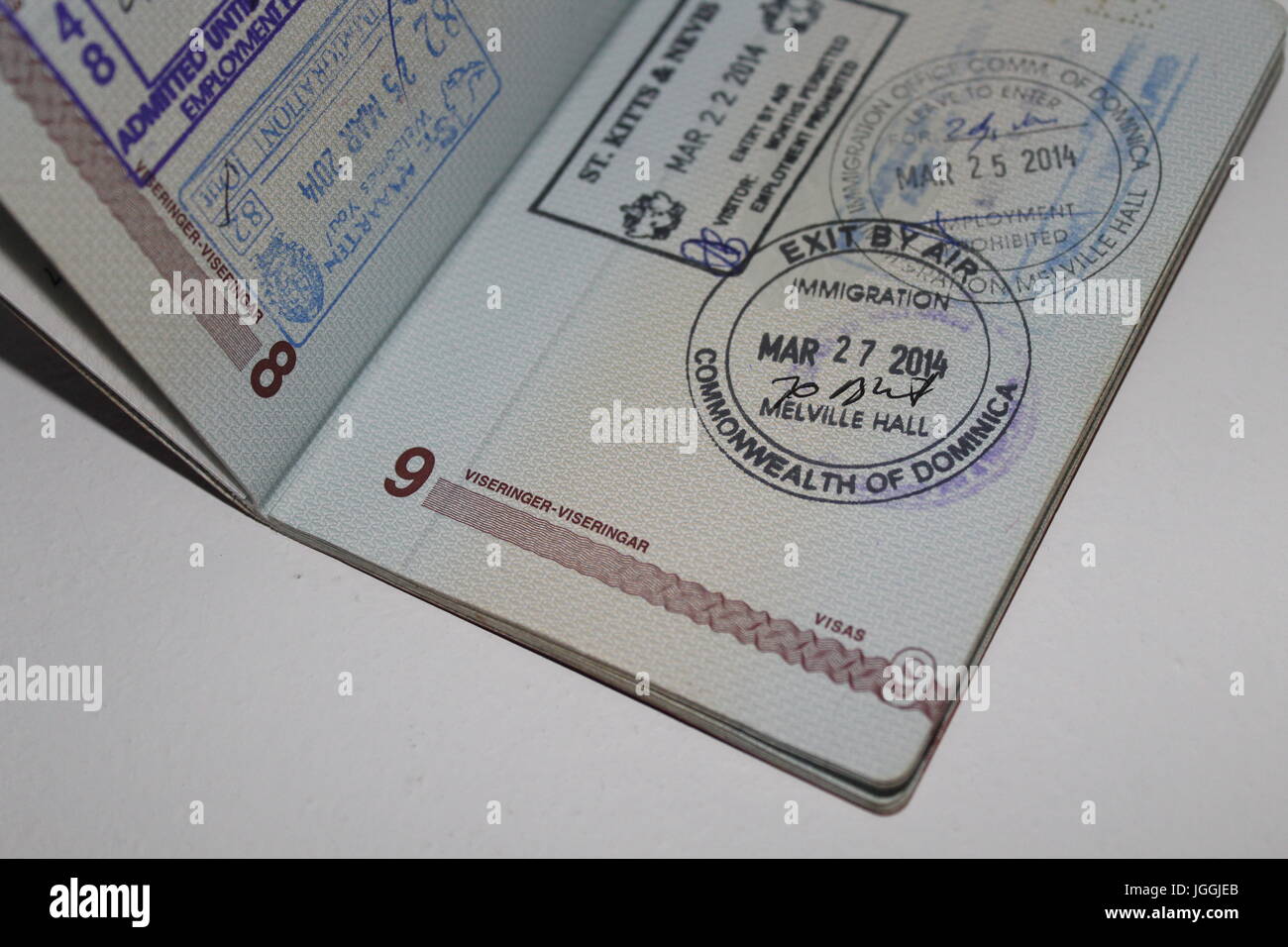Open passport with various stamps Stock Photo