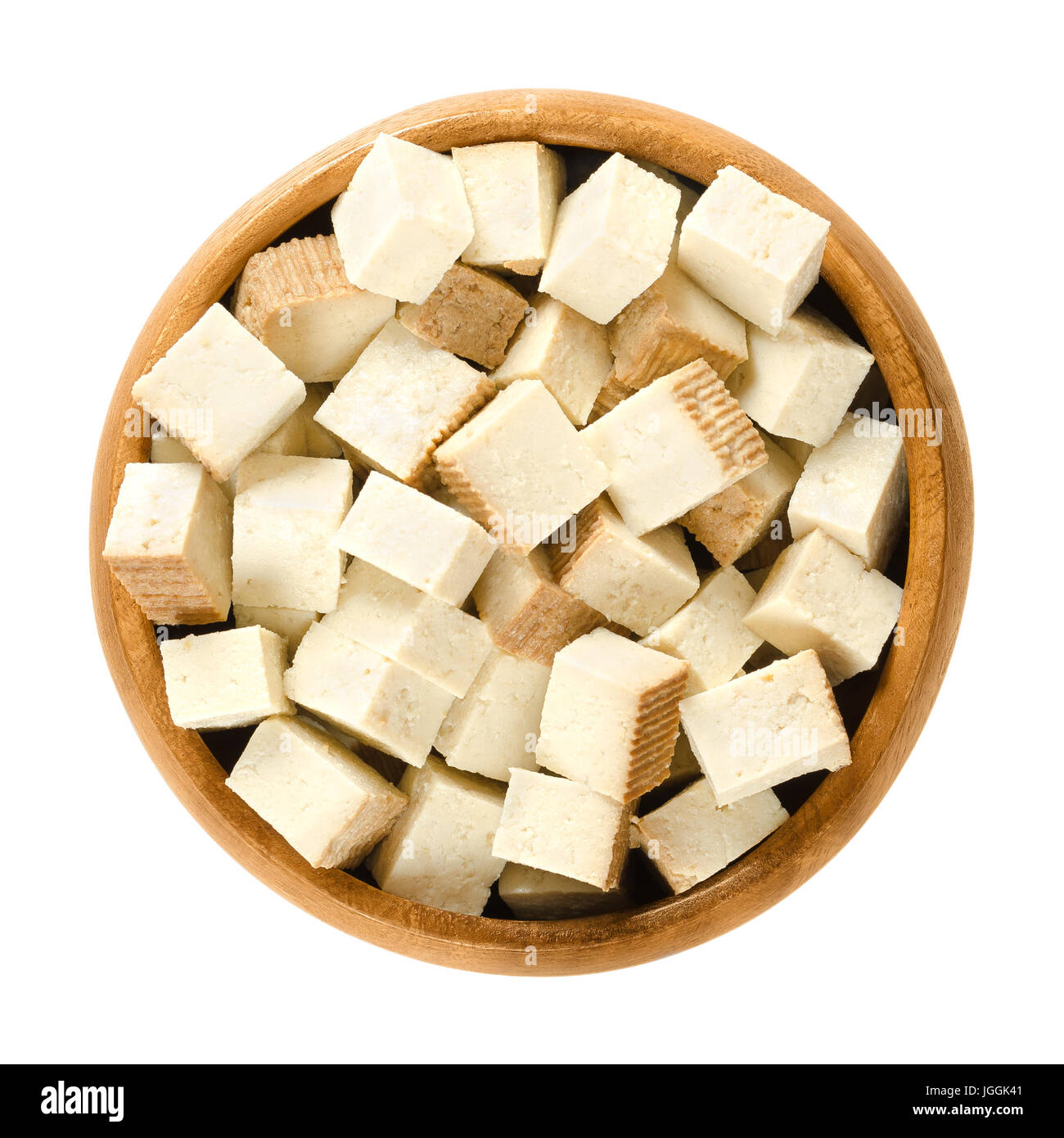 Smoked tofu cubes in wooden bowl. Bean curd. Coagulated soy milk