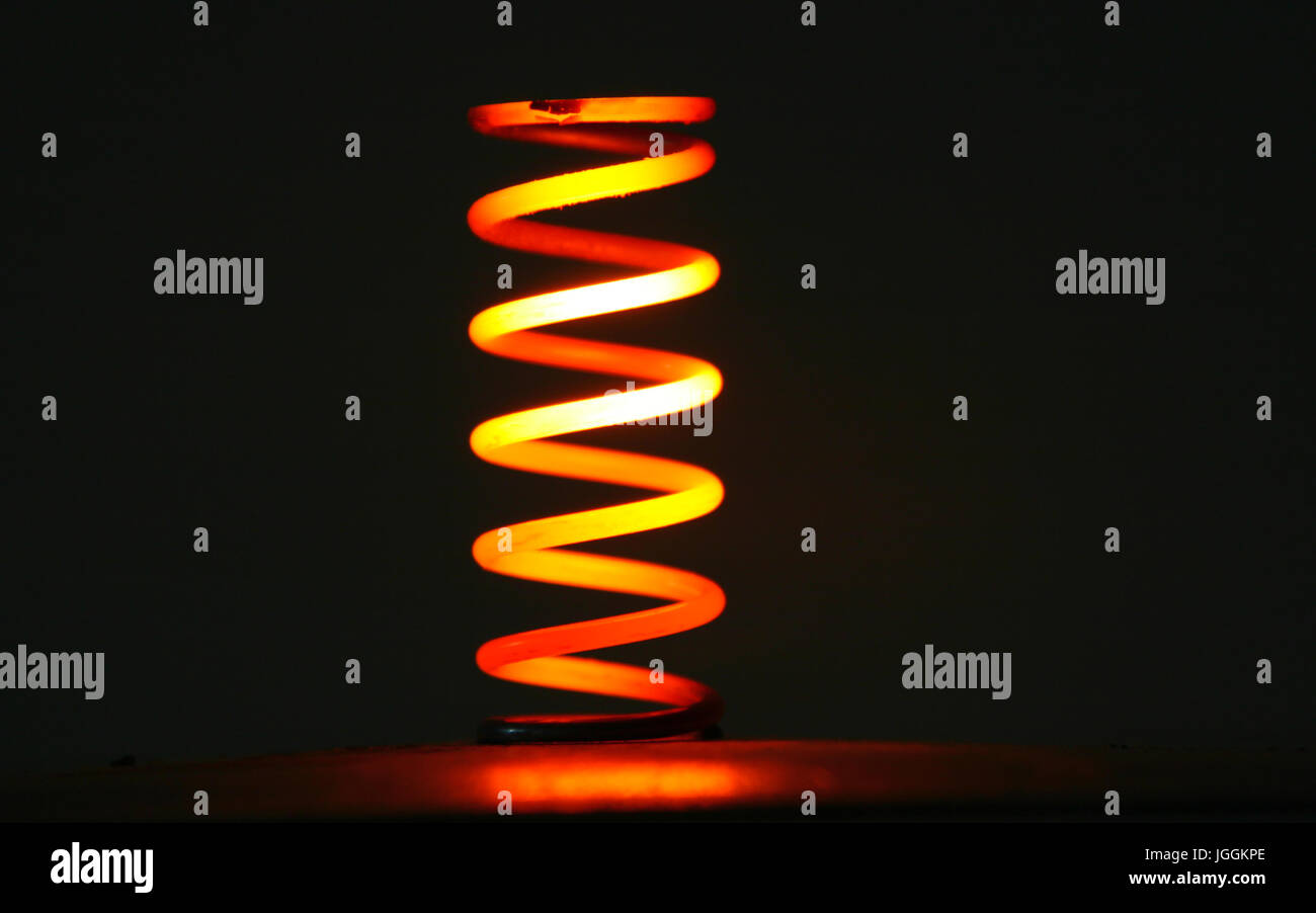 Red hot glowing steel spring Stock Photo Alamy