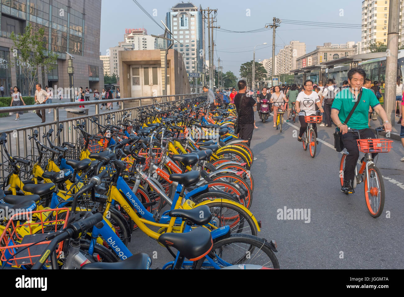People ride shared bikes in Beijing, China. 07-Jul-2017 Stock Photo
