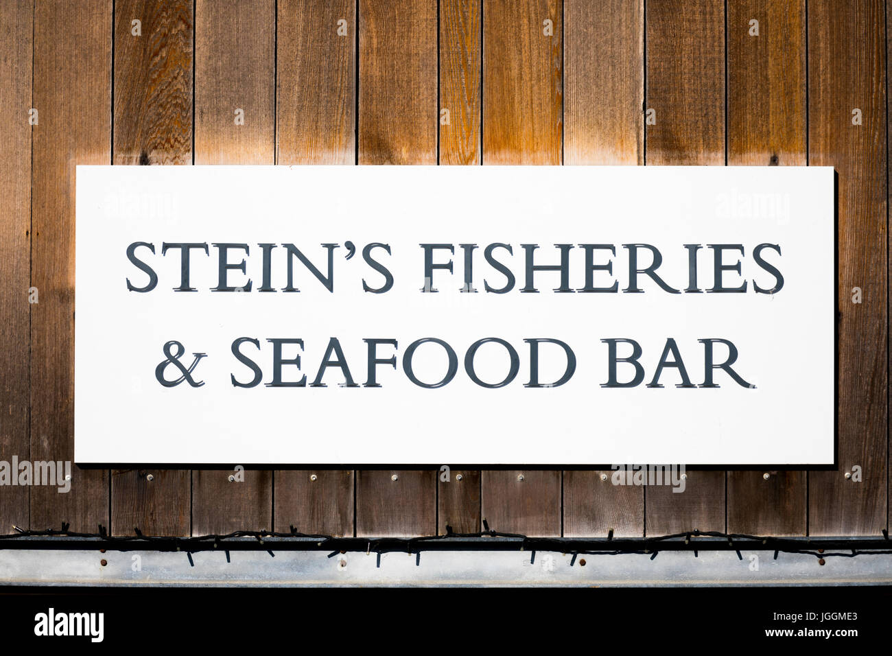 Shop sign at Rick Steins Fisheries and seafood bar at the popular seaside fishing town of Padstow, Cornwall, England Stock Photo