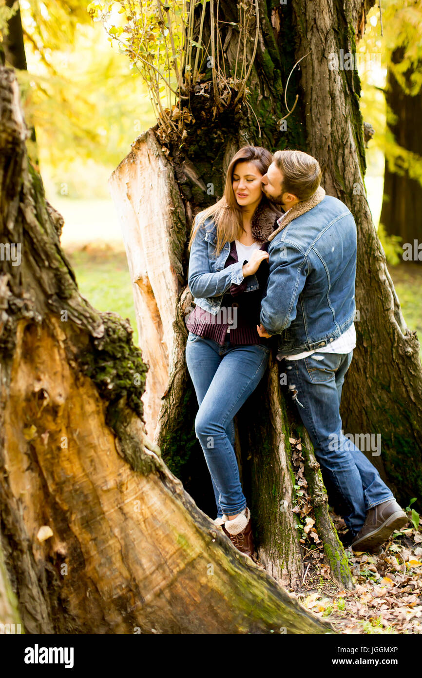 View at loving couple in autumn park Stock Photo - Alamy