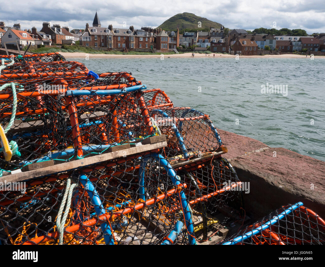 stack of crab and lobster pots (creels) on the harbour at North Berwick, East Lothian, Scotland Stock Photo