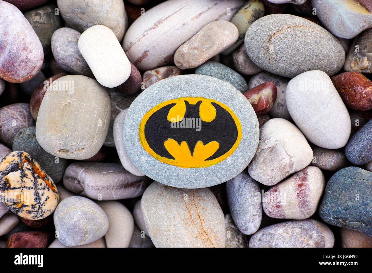 Paphos, Cyprus - November 22, 2016 Sign Batman painted on pebble with pebbles background. Stock Photo