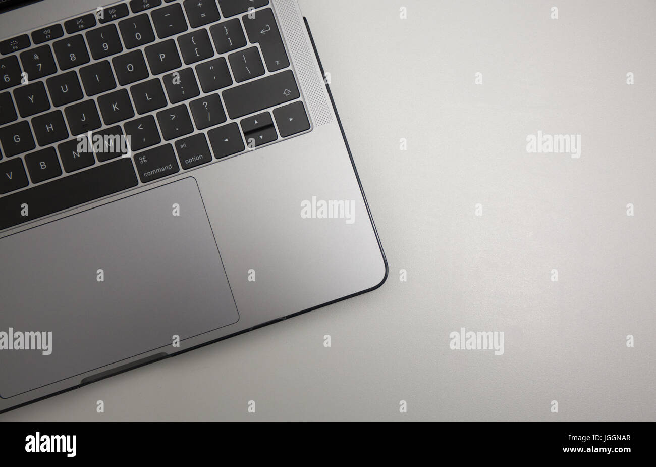 Laptop on flat grey background with room for copy or text. Stock Photo