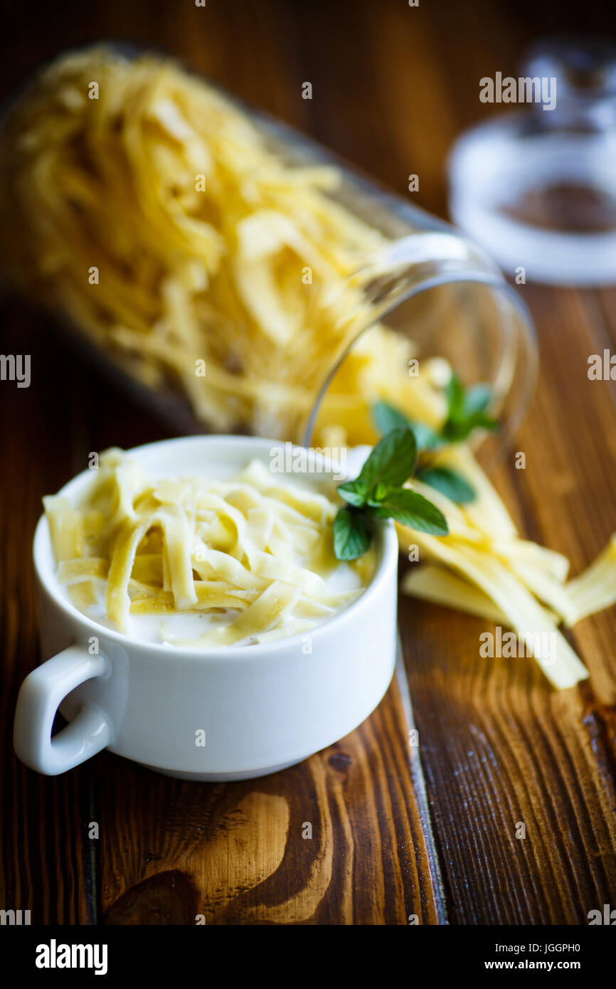 Sweet noodles with milk in a plate Stock Photo Alamy