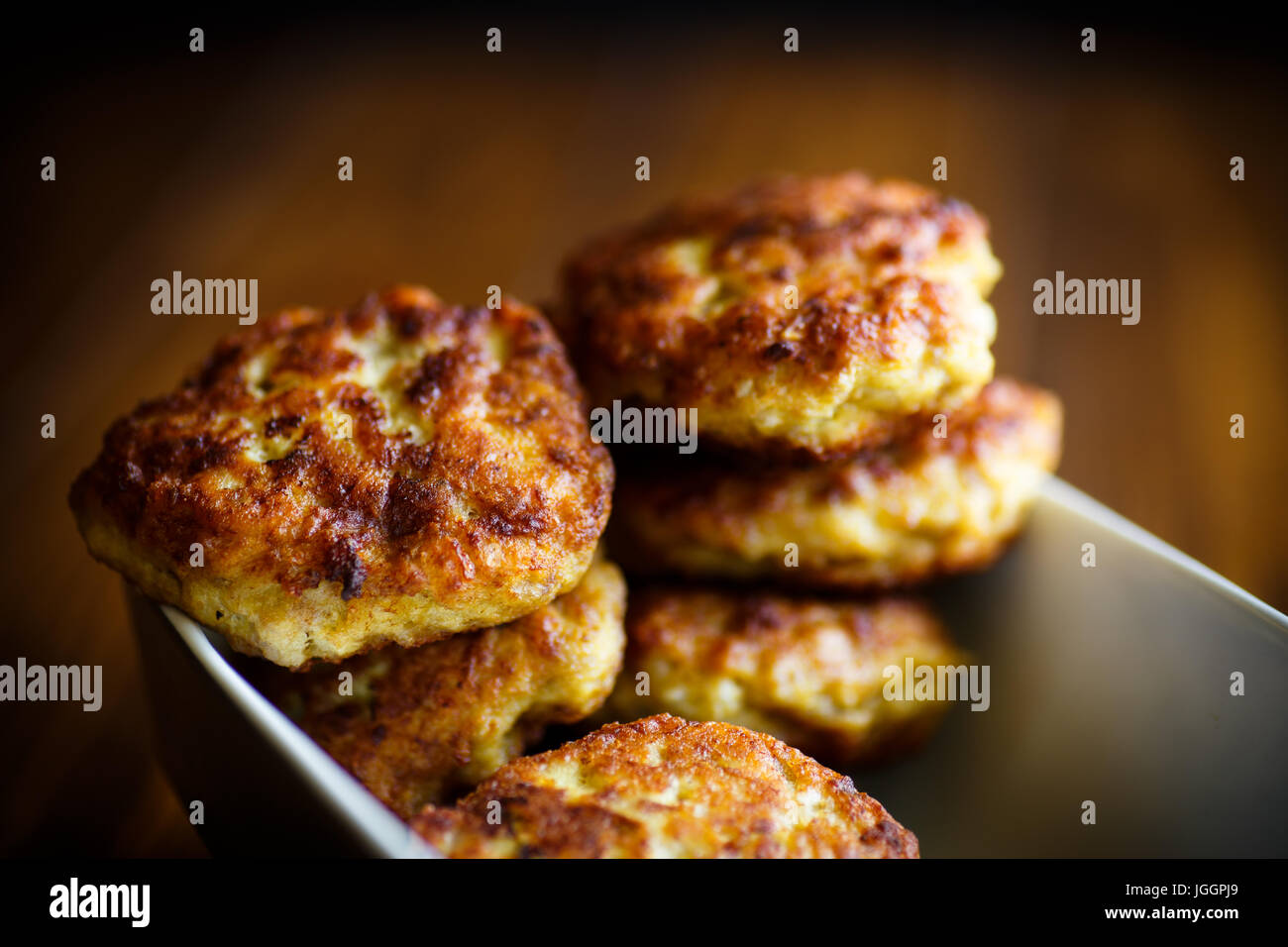 Fried meat patties in ceramic form Stock Photo Alamy