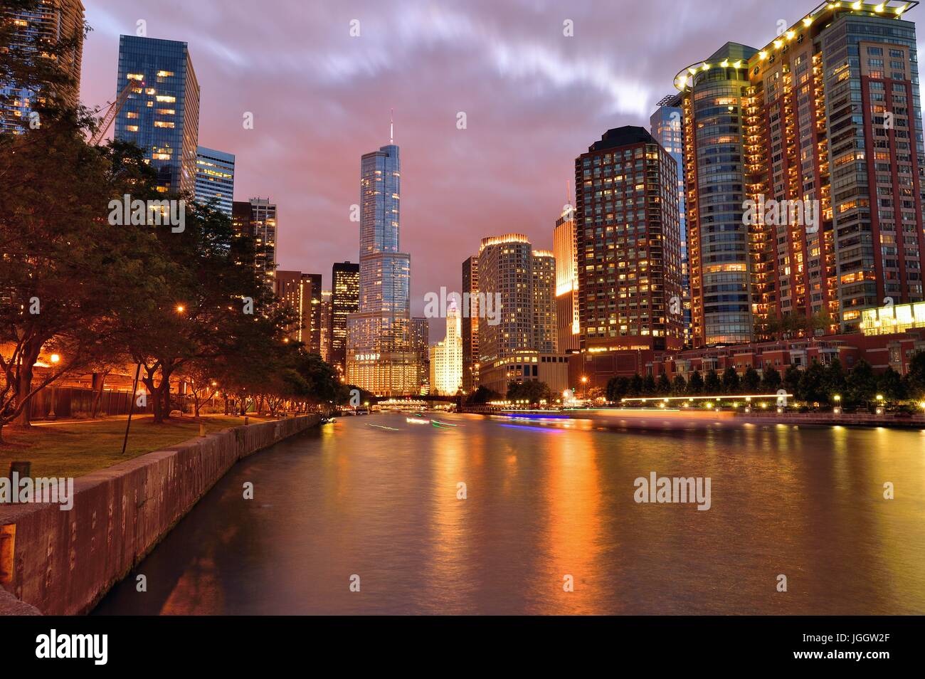 Dusk and night settle over Chicago as the lights come on all about the