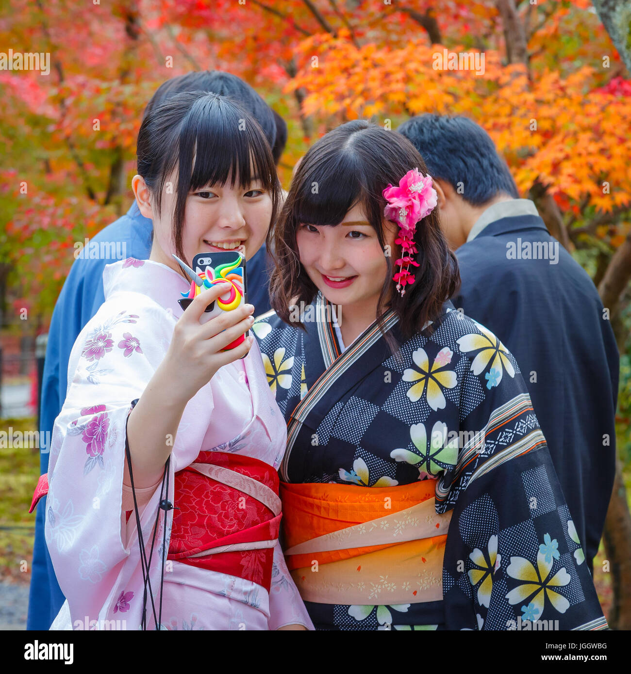 KYOTO, JAPAN - NOVEMBER 22 2015: Unidentified young Japanese women take selfie with a mobilephone Stock Photo