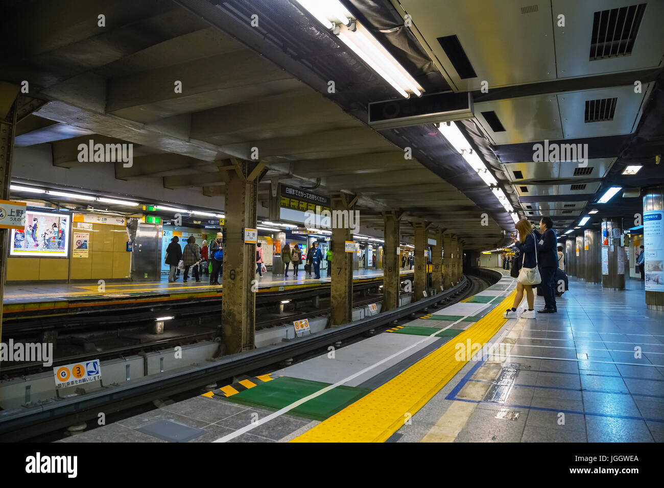 Japanese subway commuter wait for a train in a Tokyo Metro subway platform  Stock Photo - Alamy