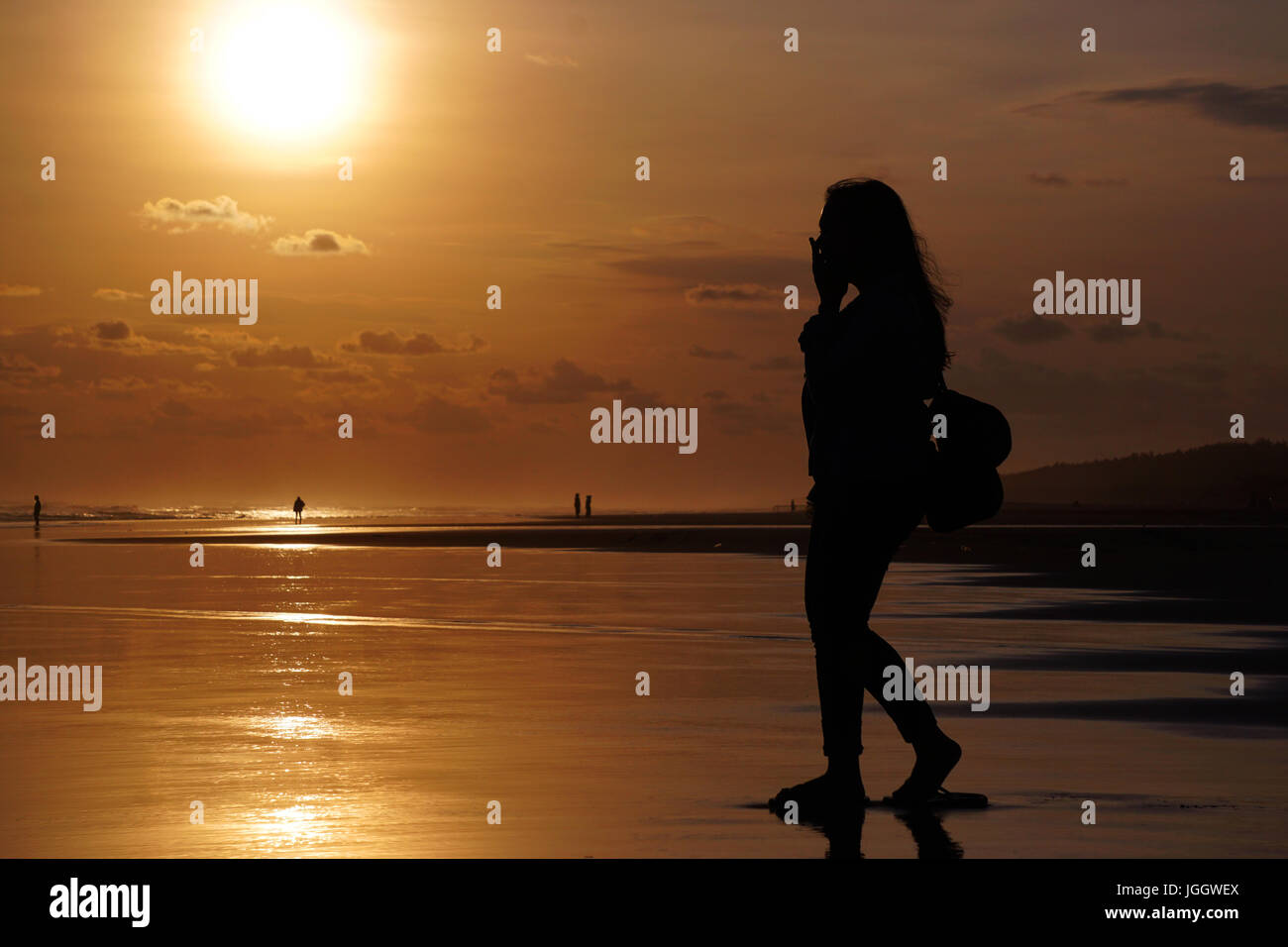 Tourists are enjoying  sunset in Parangtritis Beach, Bantul, Yogyakarta Stock Photo