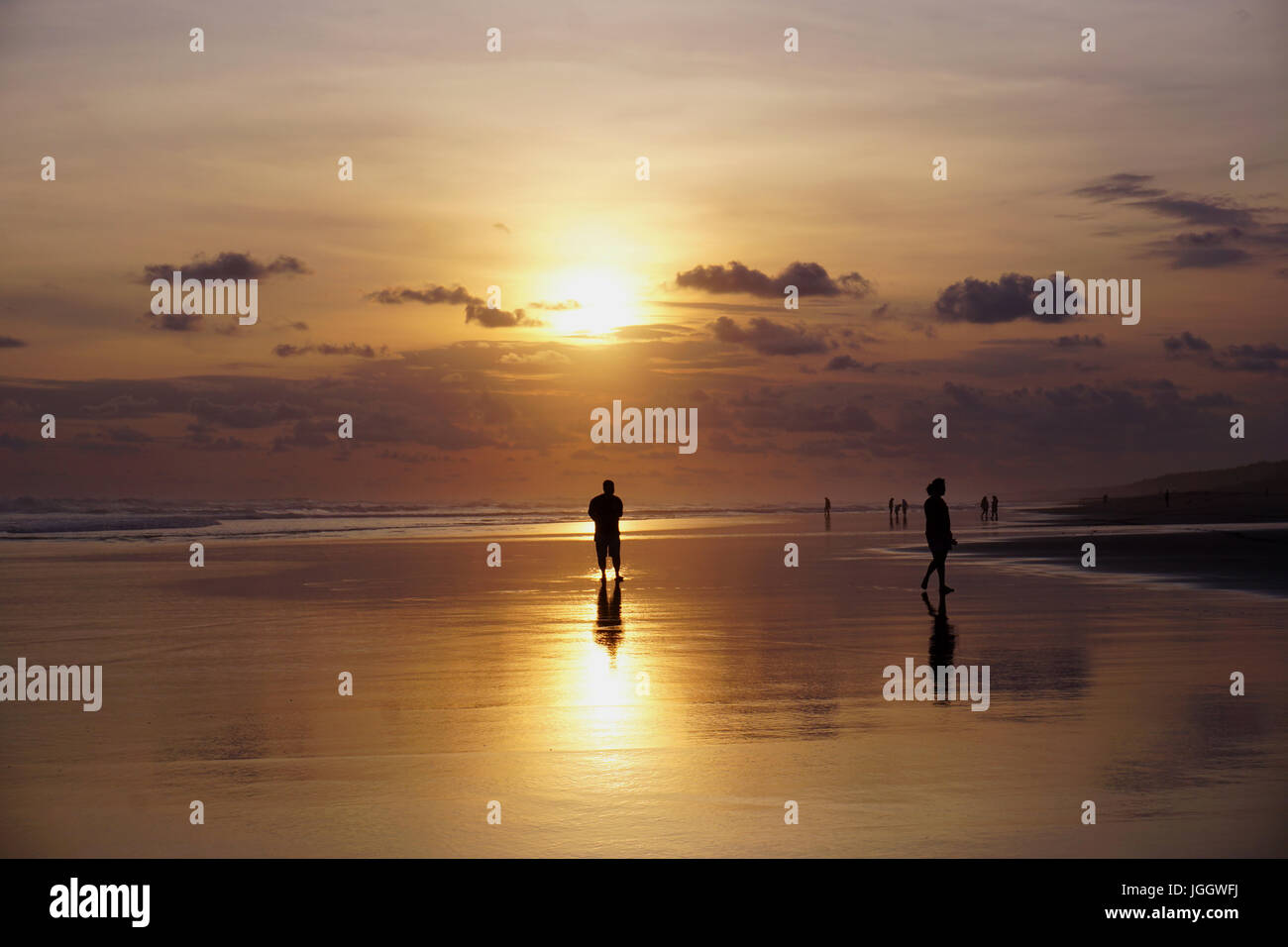 Tourists are enjoying  sunset in Parangtritis Beach, Bantul, Yogyakarta Stock Photo