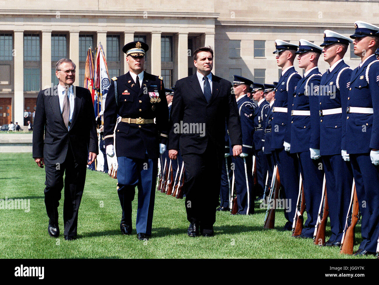 President Boris Trajkovski (right), of the Former Yugoslav Republic of Macedonia, is escorted by the Honorable Donald H. Rumsfeld (left), U.S. Secretary of Defense and U.S. Army  Col. Thomas M. Jordan (center), Commander of Troops, during an inspection of the ceremonial honor guard at the Pentagon on May 2, 2001. Stock Photo