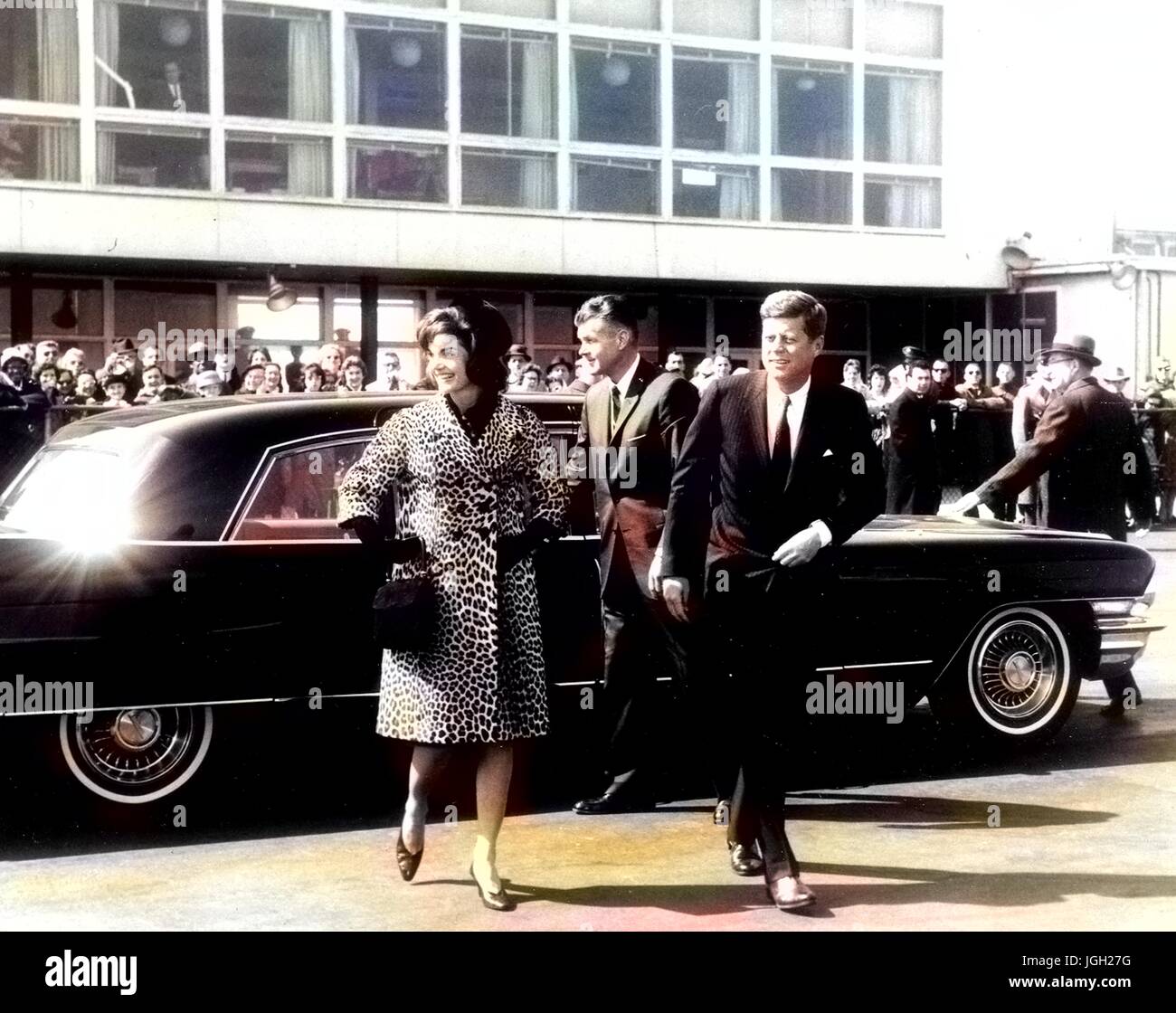 US President John F Kennedy and Jacqueline Kennedy exit an automobile, 1961. Courtesy Abbie Row/National Parks Service. Note: Image has been digitally colorized using a modern process. Colors may not be period-accurate. Stock Photo