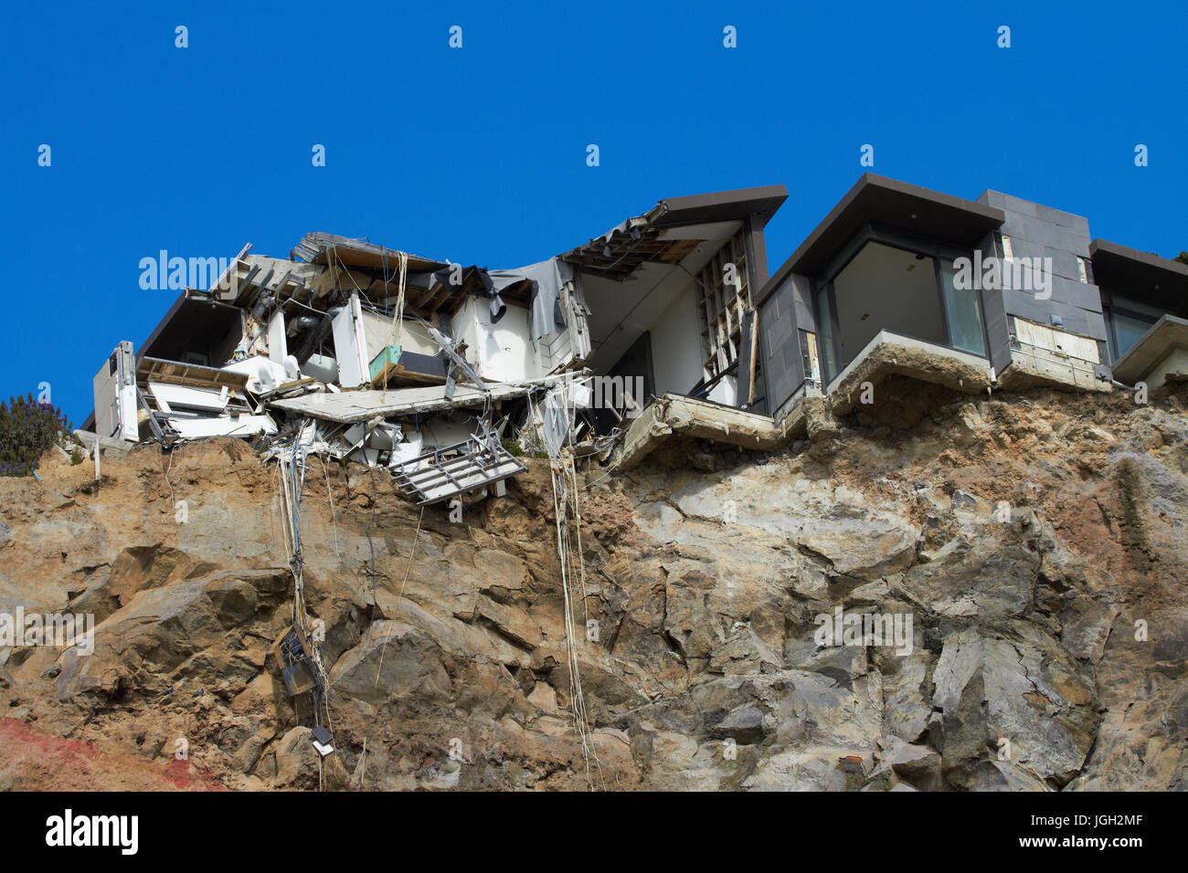Clifftop house damaged by earthquake, Sumner, Christchurch, Canterbury, South Island, New Zealand Stock Photo