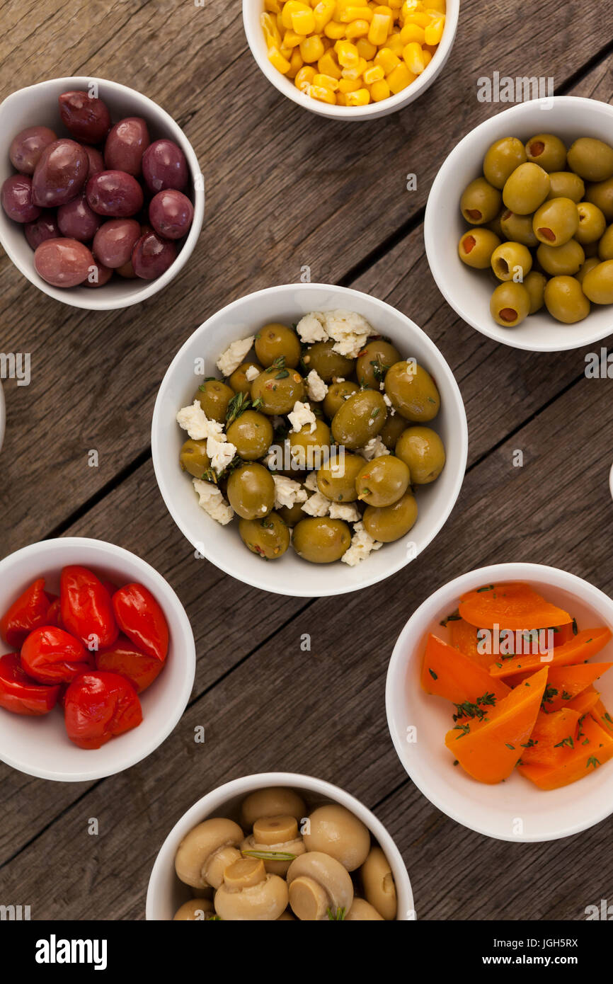 Close up of various food in bowls arranged on table Stock Photo