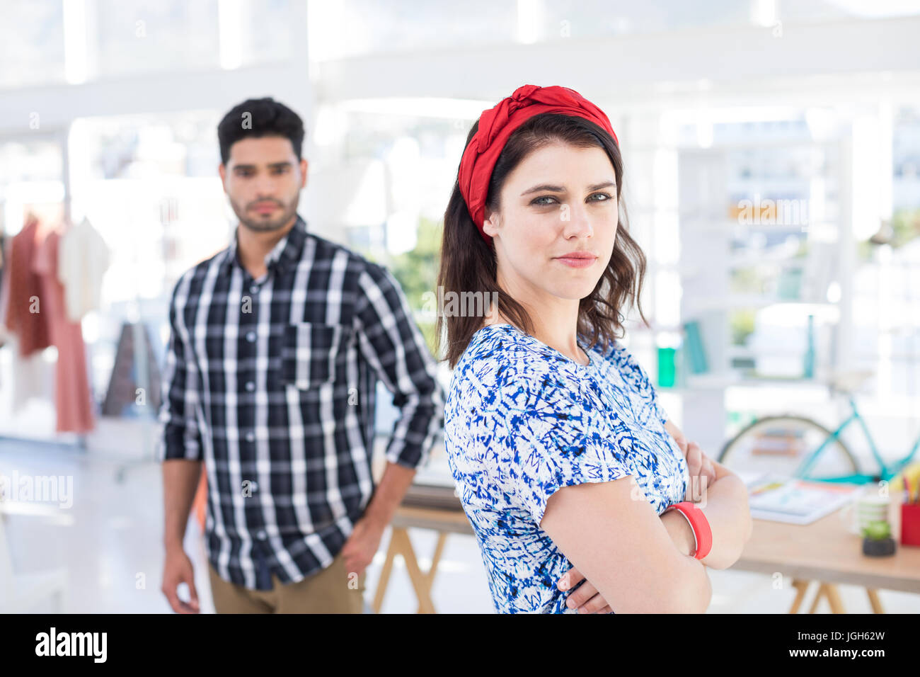 Portrait of couple standing together in the office Stock Photo - Alamy