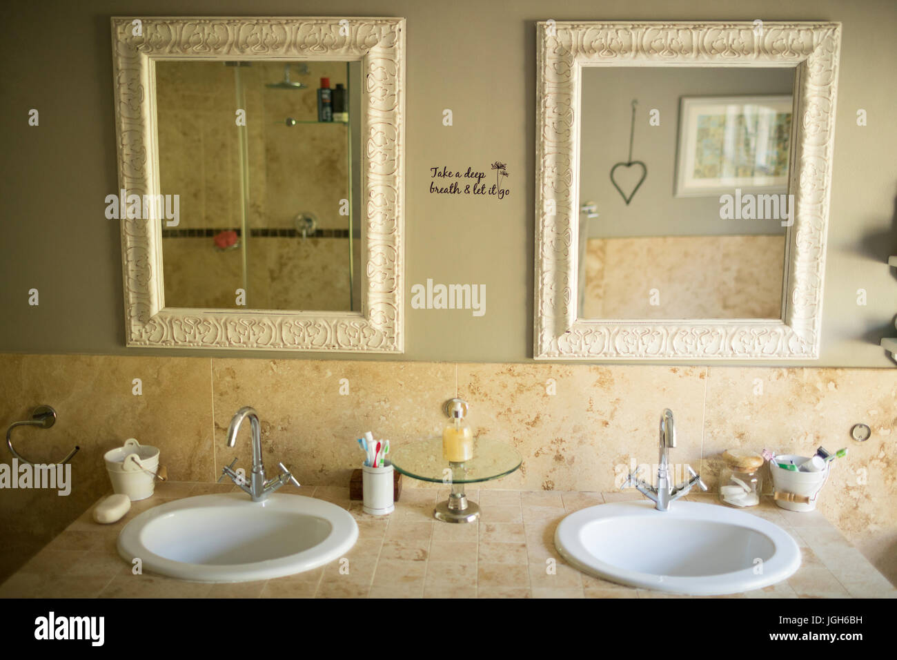 Mirror over sinks in bathroom Stock Photo Alamy