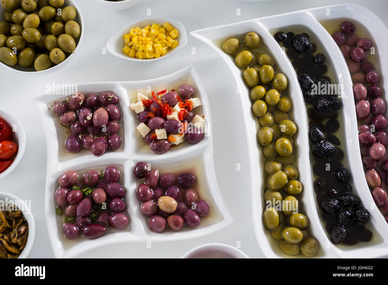 Various pickled olives arranged on white background Stock Photo Alamy