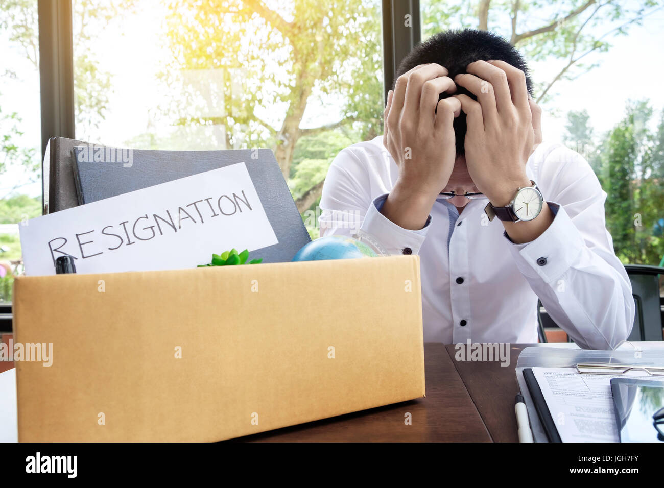 Businessman packing up desk hi-res stock photography and images - Alamy