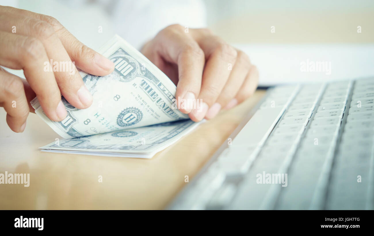 Bank employees are counting banknotes received or paid to customers ...