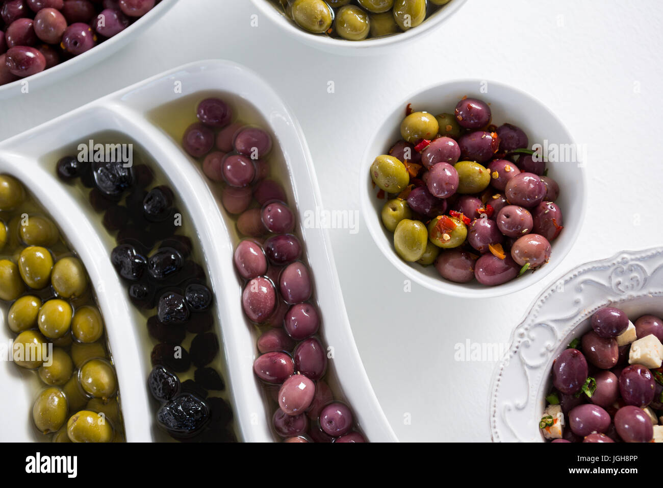 Pickled olives arranged on white background Stock Photo Alamy