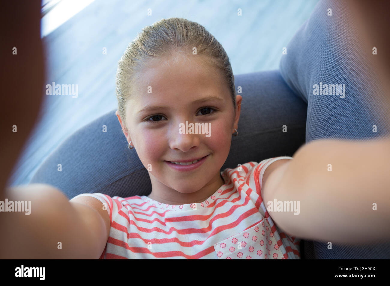 Girl lying on sofa hi-res stock photography and images - Alamy