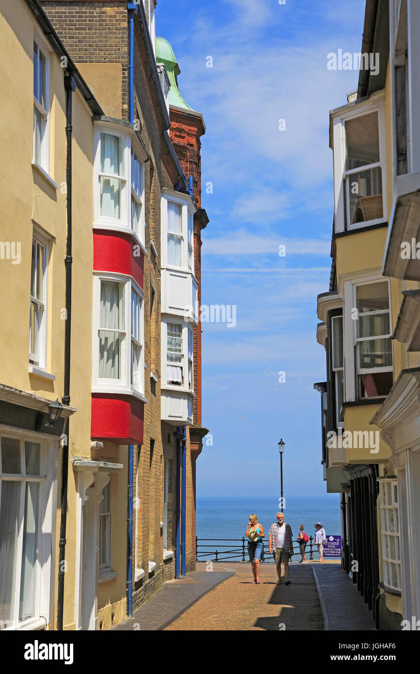 Sea view past historic houses in street, Cromer, Norfolk, England, UK