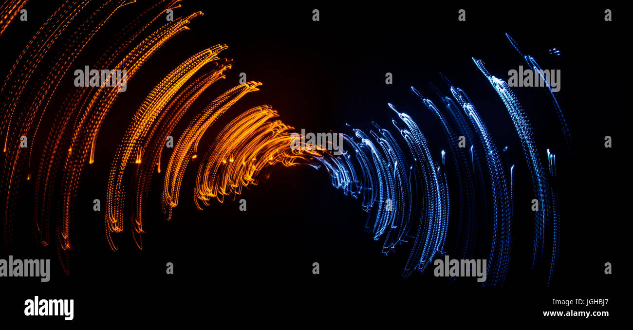 Colorful abstract trails of light. Dots, lines and bokeh on dark ...