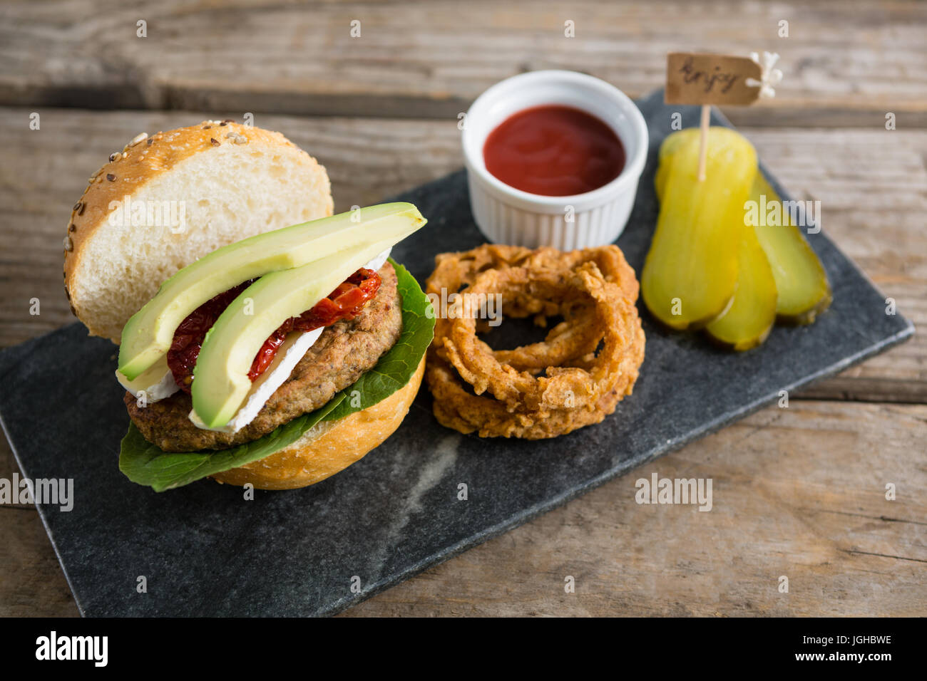 High angle view of food with burger on slate at table Stock Photo