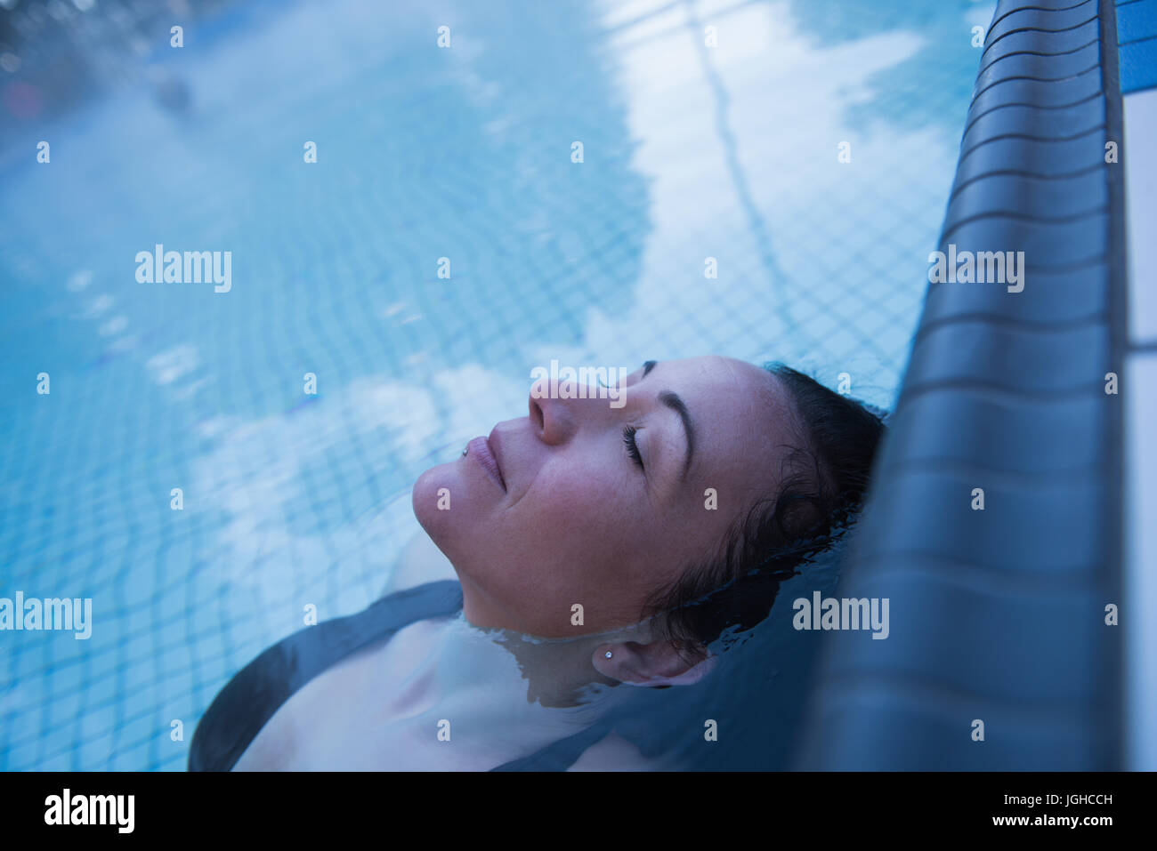 Young Woman Relaxing In The Swimming Pool Stock Photo Alamy