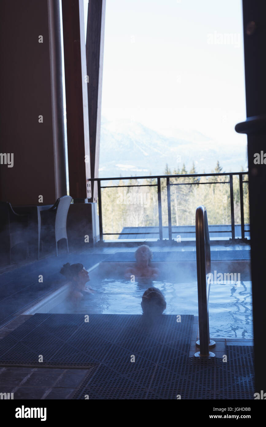 Friends relaxing in hot tub at home Stock Photo - Alamy
