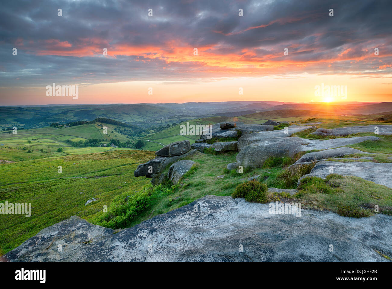 Back Tor Sunset Dramatic sunset sky over Higger Tor in the Peak District national park ...