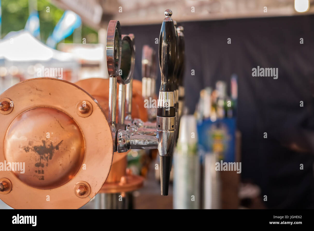 Drought beer taps and other beverages in a bar. Stock Photo
