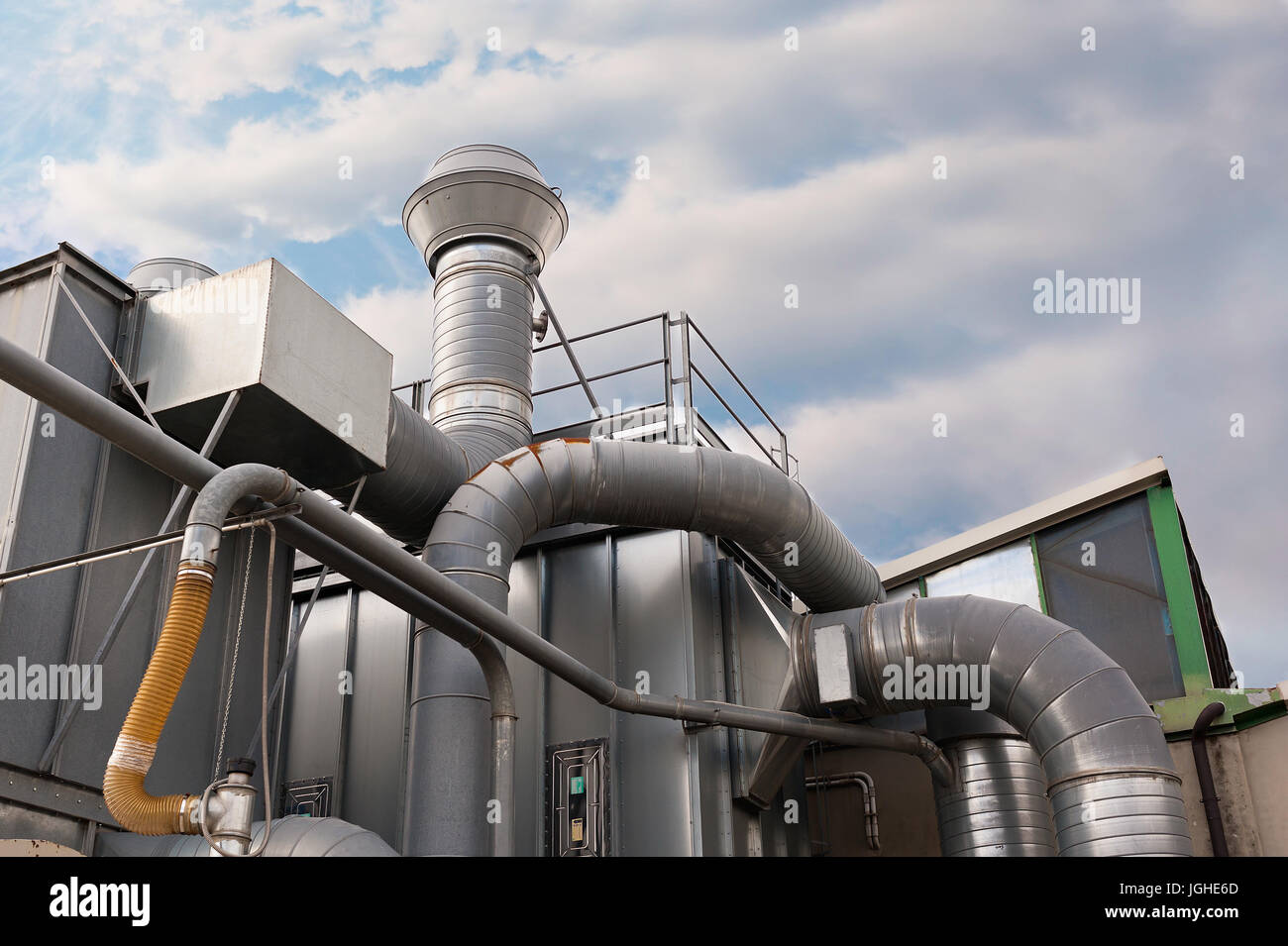 Industrial factory air filtration system. Tubes, tank and chimney. Stock Photo