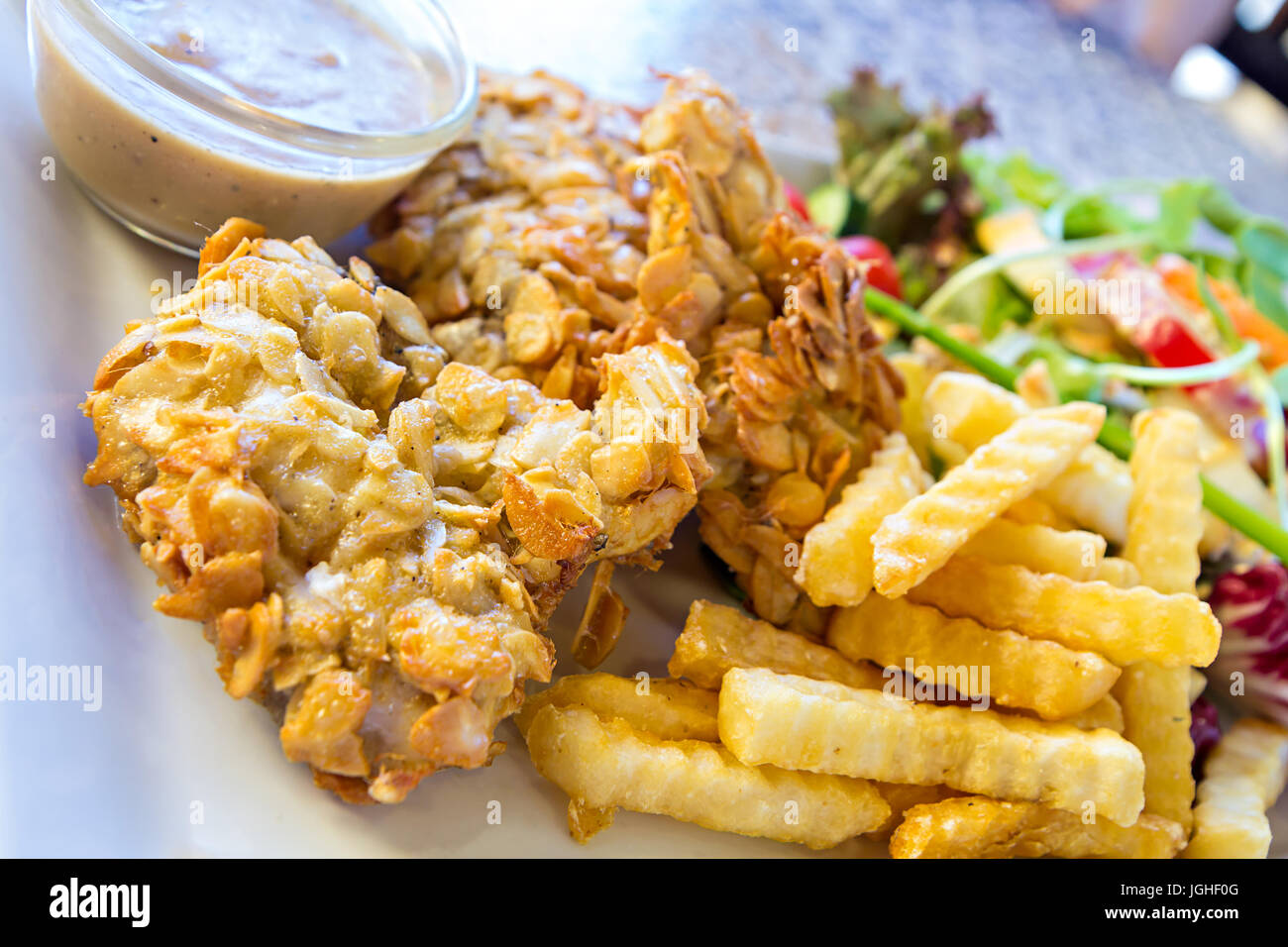 deepfried fish steaks with almond flakes and friend fried Stock Photo Alamy