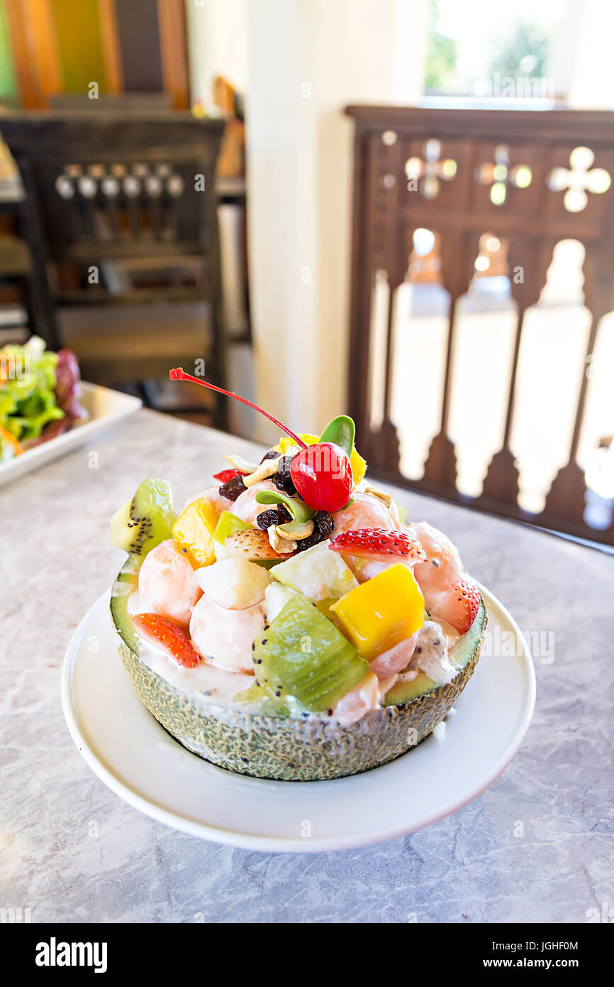 Fruit salad in melon slice hi-res stock photography and images - Alamy